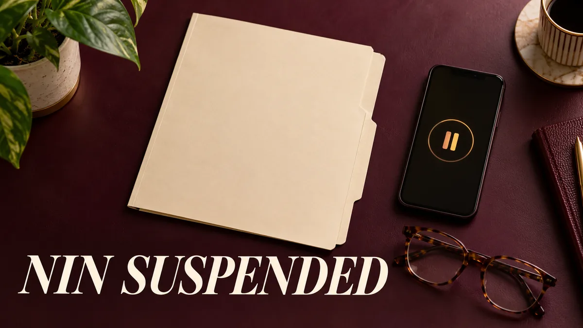 Blank document folder and phone pause symbol with NIN suspended headline.